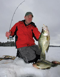 Image of Dan Johnson with Crappies on ice